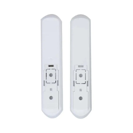 Sleek white Dahua wireless smart door sensor installed on a window frame, highlighting its compact design.