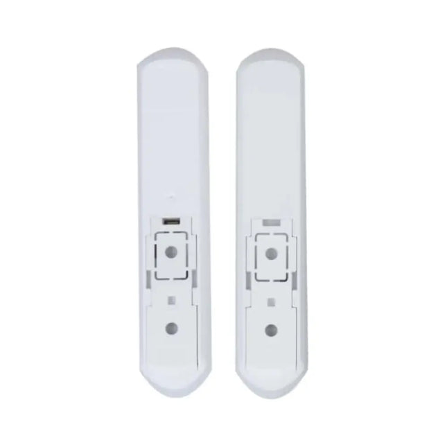 Sleek white Dahua wireless smart door sensor installed on a window frame, highlighting its compact design.