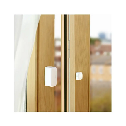 Front view of the discreet white Eve 10EBN9951 smart door and window contact sensor, operating locally without cloud reliance for total data privacy.