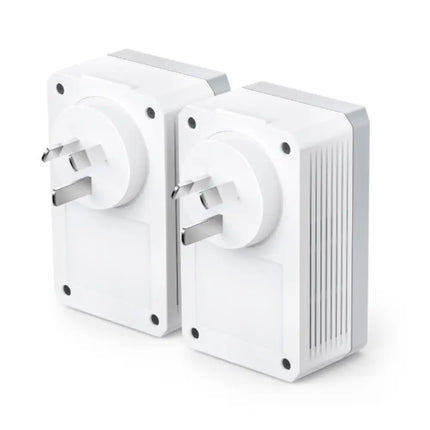 Product packaging and two TP-Link AV600 pass-through powerline adapters, showcasing how they preserve wall outlet availability.