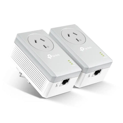 TP-Link AV600 Passthrough Powerline Adapter Kit featuring two white adapters with integrated extra power sockets plugged into a wall.
