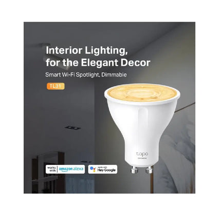 Energy-saving TP-Link Tapo TL31 dimmable smart LED spotlight emitting a warm 2700K glow, highlighting its 350-lumen brightness.