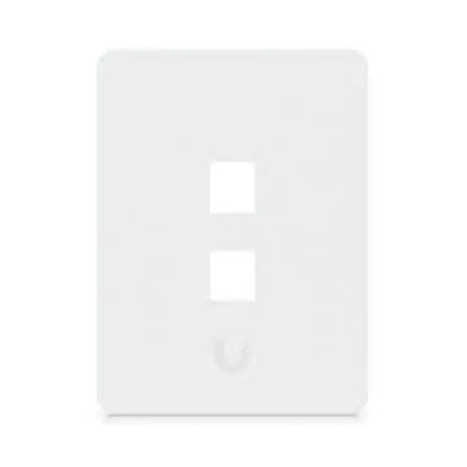 Close-up of a paintable white Ubiquiti vertical keystone network wall plate with empty port slots