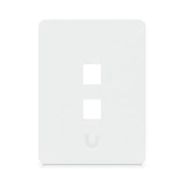 Close-up of a paintable white Ubiquiti vertical keystone network wall plate with empty port slots