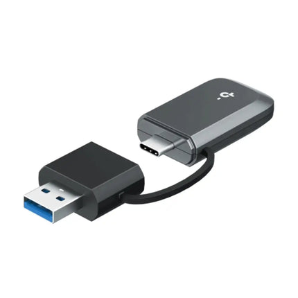 Compact TP-Link Archer TBE230U Wi-Fi 7 wireless adapter plugged into the USB-C port of a modern laptop for high-speed internet.