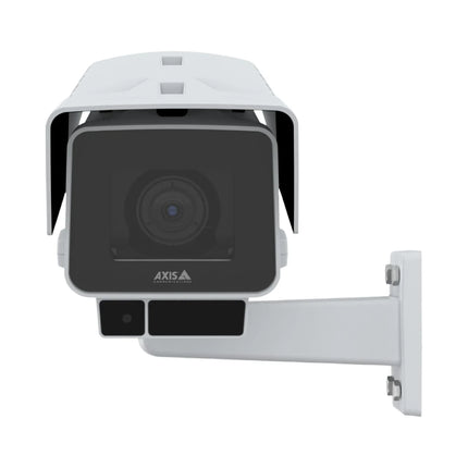 AXIS P1387-LE day and night box camera mounted on an outdoor heavy-duty wall bracket for commercial surveillance.