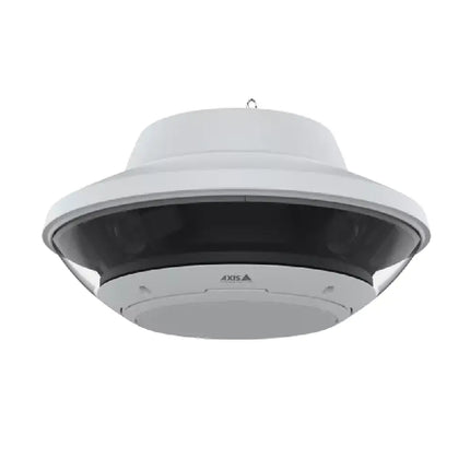 Wall-mounted AXIS Q6020-E network camera overlooking a large commercial parking lot and perimeter security zone.