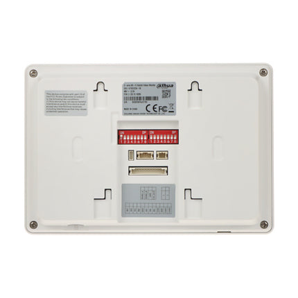 Side angle profile of the wall-mounted Dahua white hybrid room station, highlighting its slim casing profile and neat surface-mount bracket installation layout.