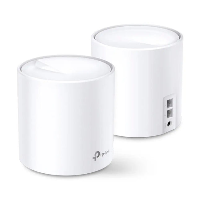 A white TP-Link Deco X20 mesh Wi-Fi 6 unit blending seamlessly into modern home decor on a wooden living room shelf.