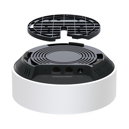 A TP-Link Deco X50-PoE unit cleanly mounted on a ceiling, demonstrating its low-profile, minimalist look.