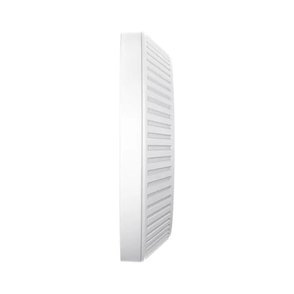 The TP-Link EAP613 AX1800 Wi-Fi 6 access point mounted seamlessly onto an office ceiling for business wireless networking.