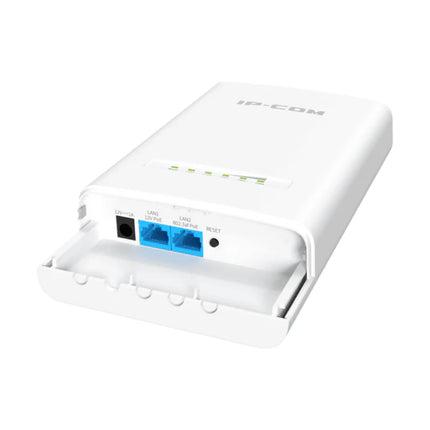 An IP-COM CPE122 high-speed outdoor wireless bridge unit pole-mounted on a building wall to transmit remote IP security camera footage.
