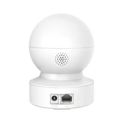 The Tapo C232 pan/tilt security camera placed on a living room shelf, acting as a smart baby monitor and indoor pet camera.
