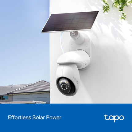 The Tapo TC92 wire-free outdoor camera and solar panel mounted on a house fence line for 24/7 sustainable home security.