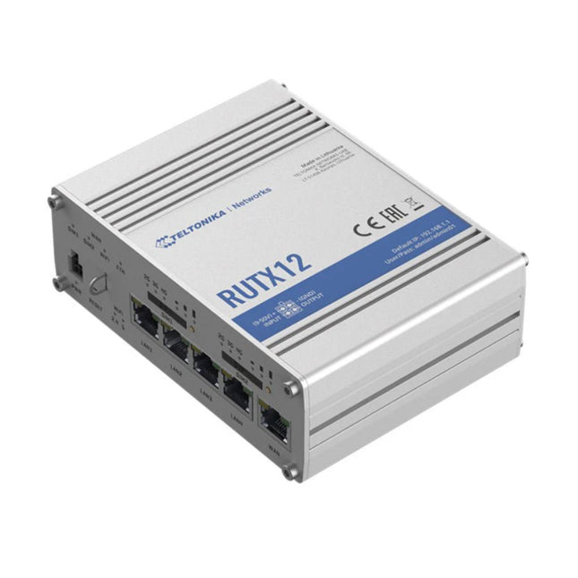 Isometric top view of the rugged black aluminum Teltonika RUTX12 dual-modem industrial LTE cellular router showing its side ventilation grooves and interface panels.