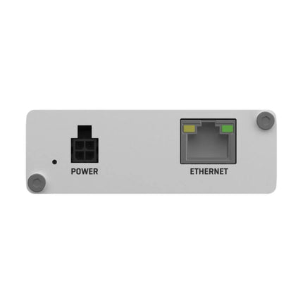 An ultra-small Teltonika TRB140 IoT gateway securely mounted on a heavy-duty industrial DIN rail inside an automation server cabinet.
