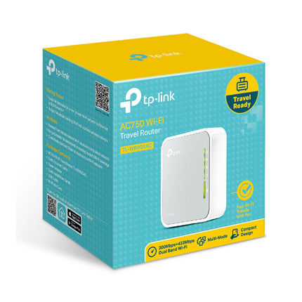 Lifestyle image displaying the miniature form factor of the TP-Link AC750 travel router next to a laptop, emphasizing its portability for field technicians and travelers.
