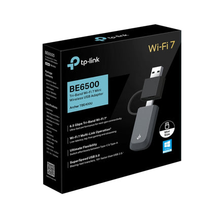 TP-Link Archer TBE400U BE6500 Tri-Band Wi-Fi 7 Mini Wireless USB Adapter plugged into a laptop port.