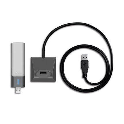 Close-up view of dual adjustable high-gain antennas and USB 3.0 desktop cradle for TP-Link Archer TX20UH.