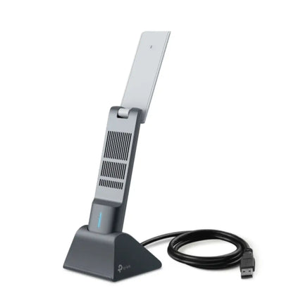 TP-Link Archer TX50UH AX3000 high gain wireless USB adapter sitting in its desktop cradle with dual adjustable antennas unfolded.