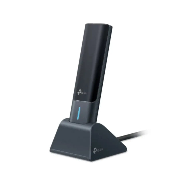 TP-Link Archer TXE50UH Wi-Fi 6E USB adapter with high-gain antennas sitting in its included desktop cradle.