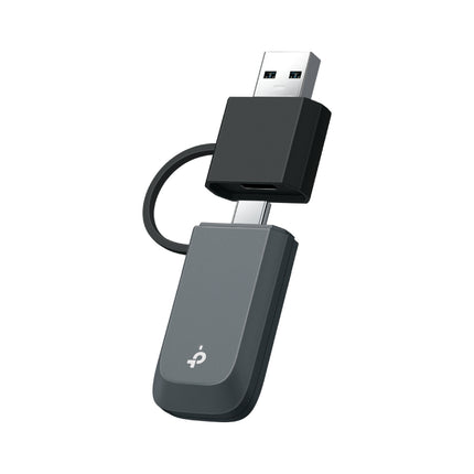 TP-Link Archer TXE70U AXE5400 tri-band Wi-Fi 6E mini wireless USB adapter with high-gain antennas.