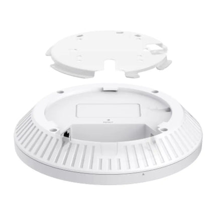 An Omada EAP653 UR ultra-range access point mounted on a spacious hotel lobby ceiling, providing expansive Wi-Fi 6 coverage for guest devices.