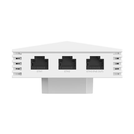 TP-Link AX3000 Wall Plate WiFi 6 Access Point seamlessly installed in a modern hotel room, showcasing its low-profile look.