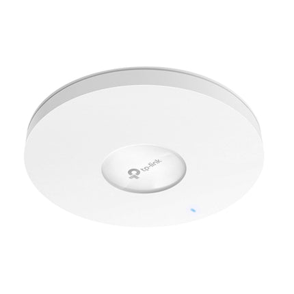 TP-Link Omada EAP772 ultra-thin enterprise Wi-Fi 7 access point mounted on a commercial office ceiling.