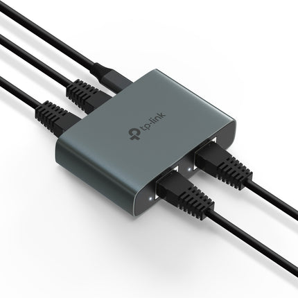 The compact TP-Link EH310 gigabit splitter expanding a single wall network outlet to connect a smart TV and a game console simultaneously.