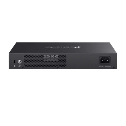 An Omada ER7406 enterprise gateway mounted in a network rack enclosure, acting as the secure central wired router for corporate internet traffic.