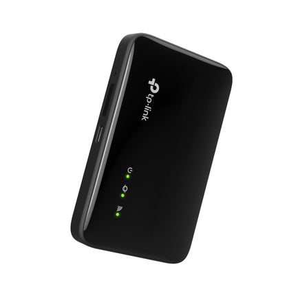 A compact, pocket-sized TP-Link M7005 portable wireless hotspot on a table, highlighting its travel-friendly form factor.