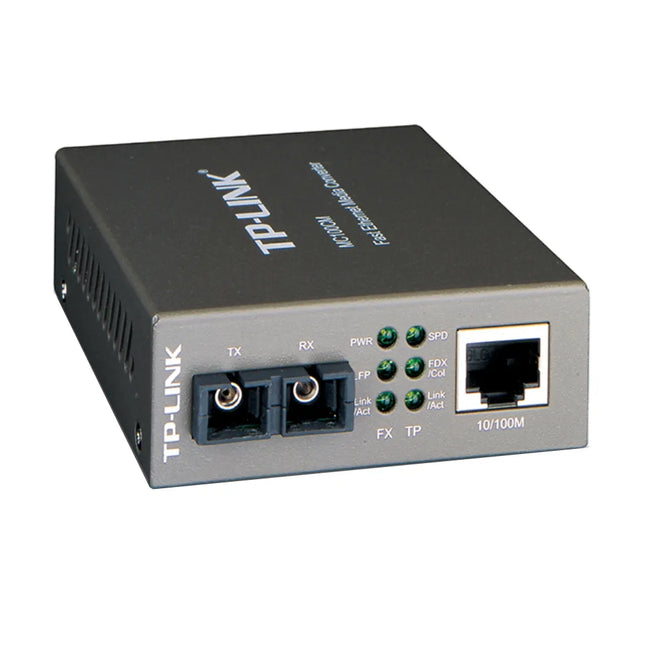 A TP-Link Omada MC100CM multi-mode media converter in a black metal housing, designed to extend fiber distances up to 2km using a 1310nm wavelength.