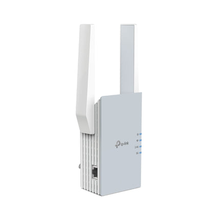 The compact TP-Link RE515X Wi-Fi 6 booster plugged into a standard home wall socket, blending seamlessly into the room.