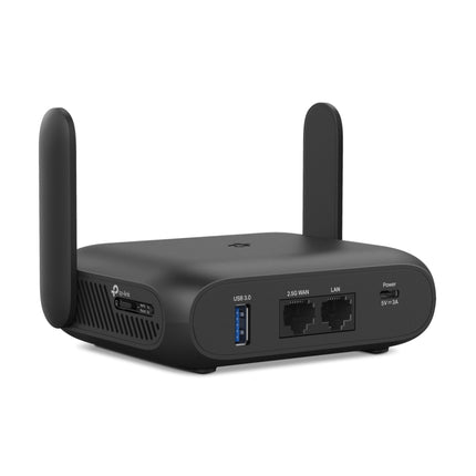 The compact pocket-sized TP-Link Roam 7 travel router running off a portable power bank via its USB-C cable.