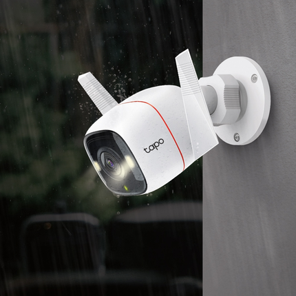 The TP-Link Tapo C320WS outdoor Wi-Fi camera mounted on a house eave, showcasing its weatherproof IP66 design.