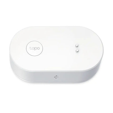Top down view of the white TP-Link Tapo T300 smart water leak sensor showcasing its compact, low-profile design.