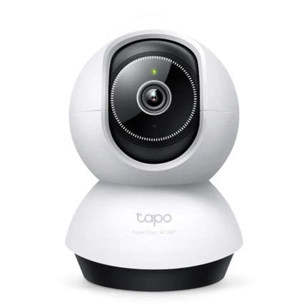 Front view of the white TP-Link Tapo TC74 indoor pan and tilt AI home security Wi-Fi camera sitting on a tabletop surface.