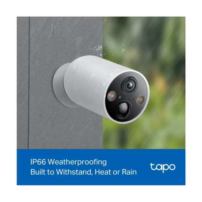 TP-Link TC85 security camera mounted on an outdoor brick wall, demonstrating its IP66 weatherproof rating during a rainy day.