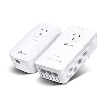 The TP-Link TL-WPA8631P KIT featuring two white powerline adapters—the TL-PA8010P base unit and the TL-WPA8631P Wi-Fi extender—both with integrated power passthrough sockets.