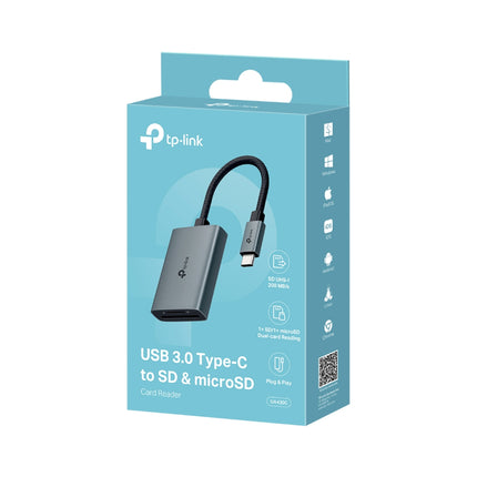 TP-Link UA430C USB-C card reader plugged into a laptop, transferring photos from a camera SD card.