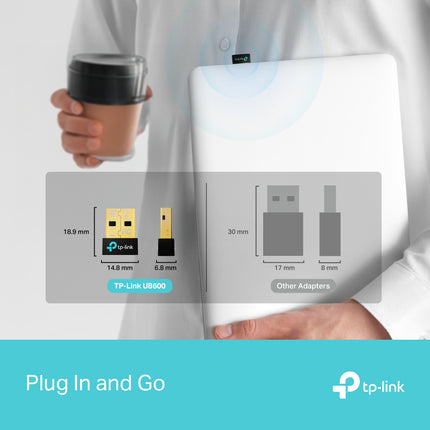 A user wearing wireless headphones streaming lossless music across the room from a PC equipped with the TP-Link UB600 Bluetooth 6.0 dongle.