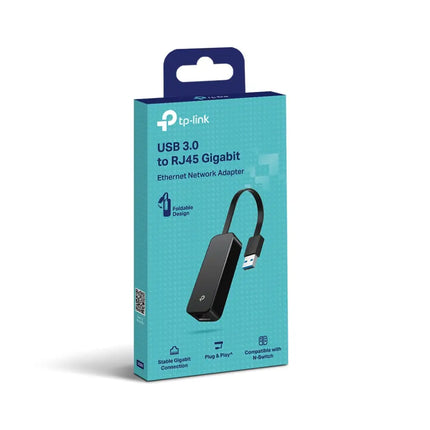 TP-Link UE306 USB 3.0 to RJ45 adapter plugged into a slim laptop, delivering a high-speed Gigabit Ethernet connection for streaming and working.