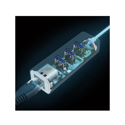 TP-Link UE330C adapter connected to a slim laptop on a desk, with an Ethernet cable and a USB flash drive plugged in.
