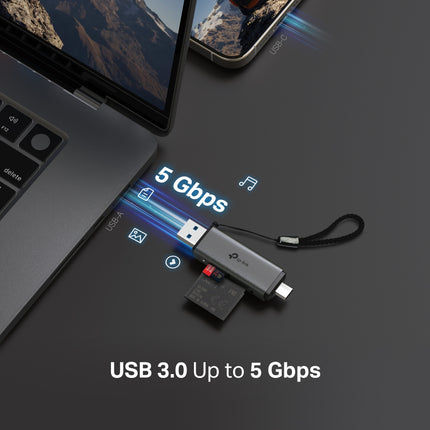 The compact TP-Link UA430D card reader connected to a laptop for fast on-the-go photography file transfers.