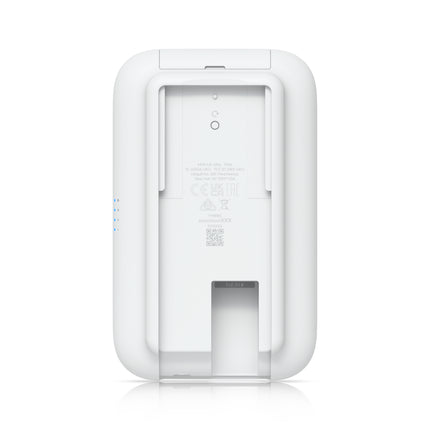 Underside perspective of the UniFi UK-Ultra showing the weather-resistant cover open, exposing the main Gigabit Ethernet PoE input network terminal.