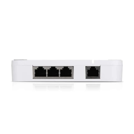 Top angled view of the Ubiquiti UA-Hub-Door highlighting the five gigabit Ethernet RJ45 ports, including one PoE++ power input and four PoE passthrough outputs for readers and cameras.
