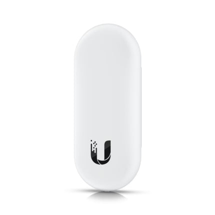 Close-up of a user tapping an encrypted smart card against the UniFi Access Reader Lite to unlock a commercial door, demonstrating its fast contactless credential entry.