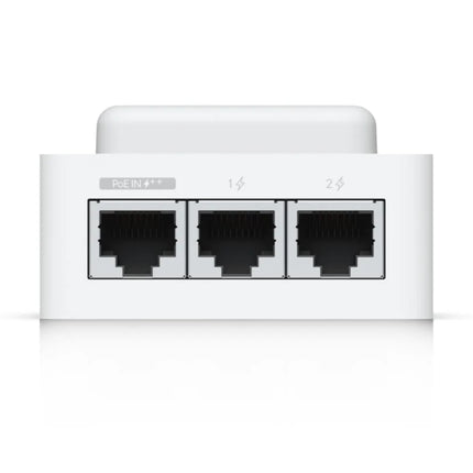 Detailed view of the terminal block inputs on the UniFi Access Hub Mini, featuring the switchable 12V or dry output lock relay, exit request button connection, and door position sensor terminals.