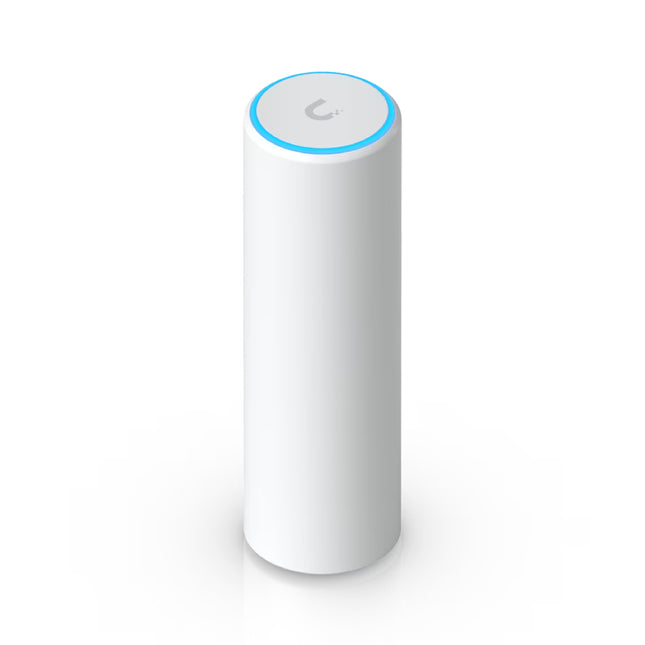 Compact cylindrical white Ubiquiti UniFi U6 Mesh WiFi 6 access point standing upright on a desk with glowing blue LED status ring at the base.